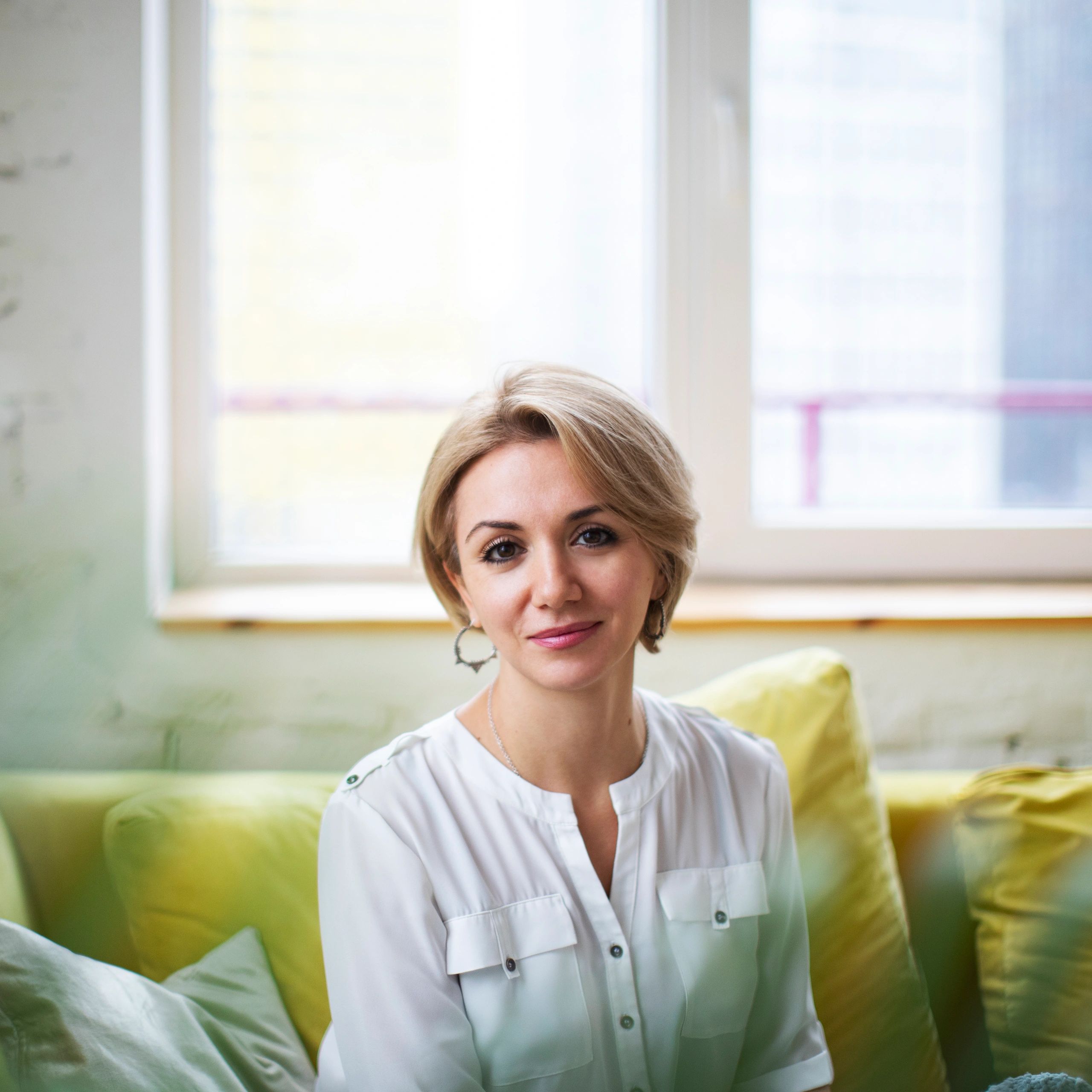Portrait of a smiling woman in soft indoor light