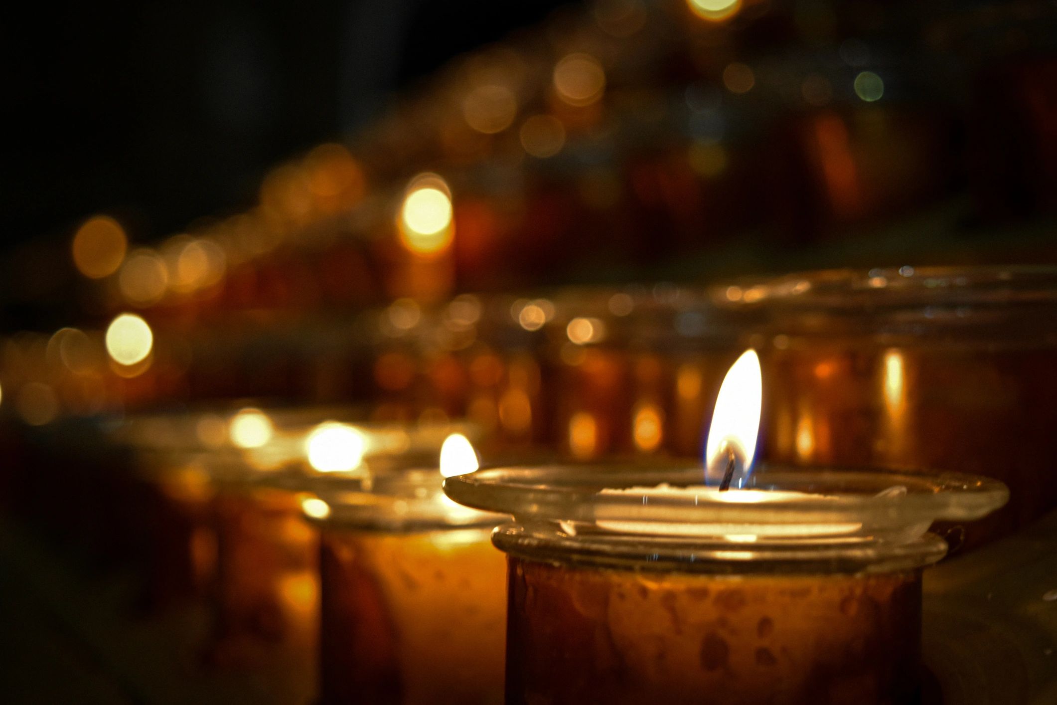 Lit candles in a warm, dim setting