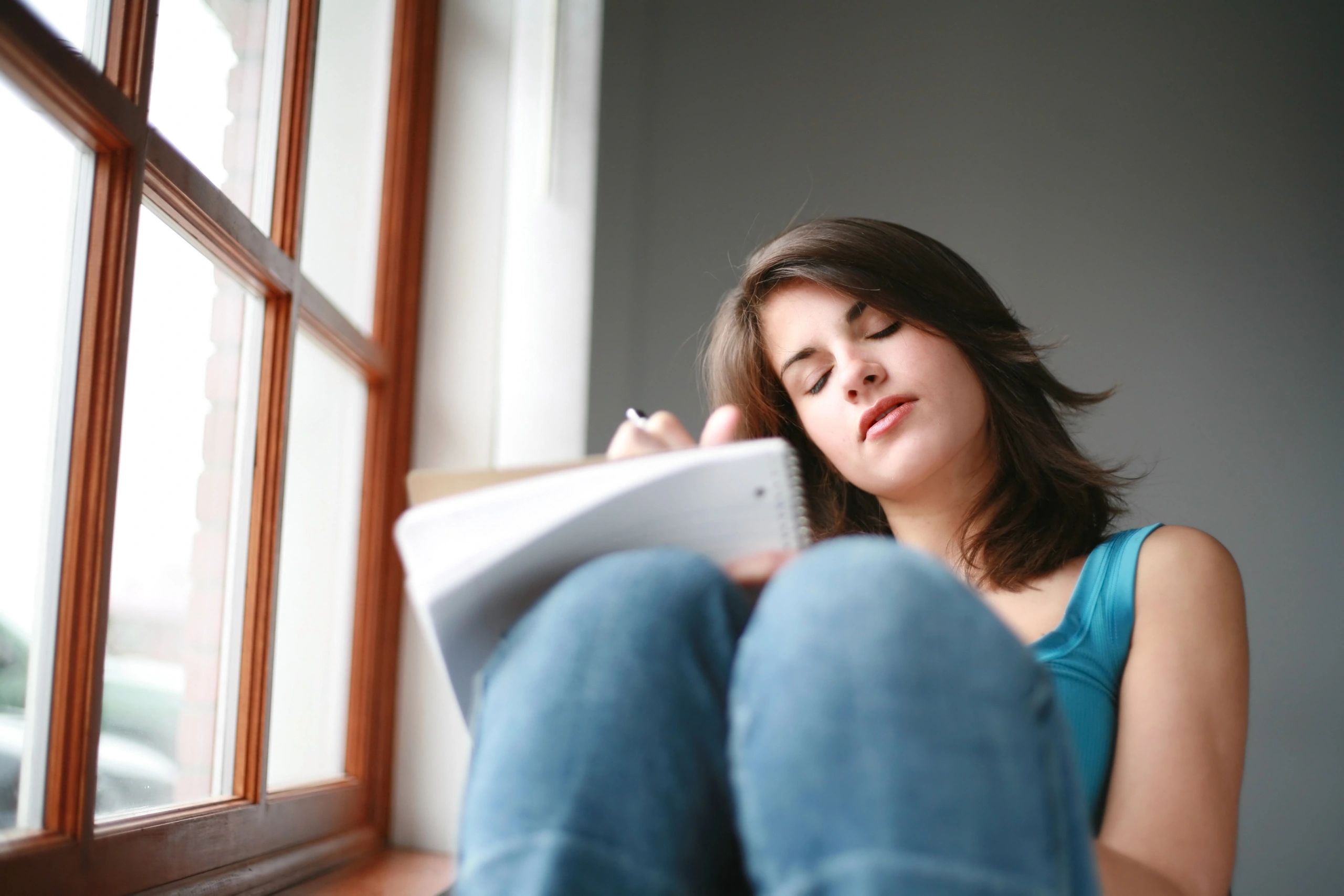 Person holding a letter close, emotional moment