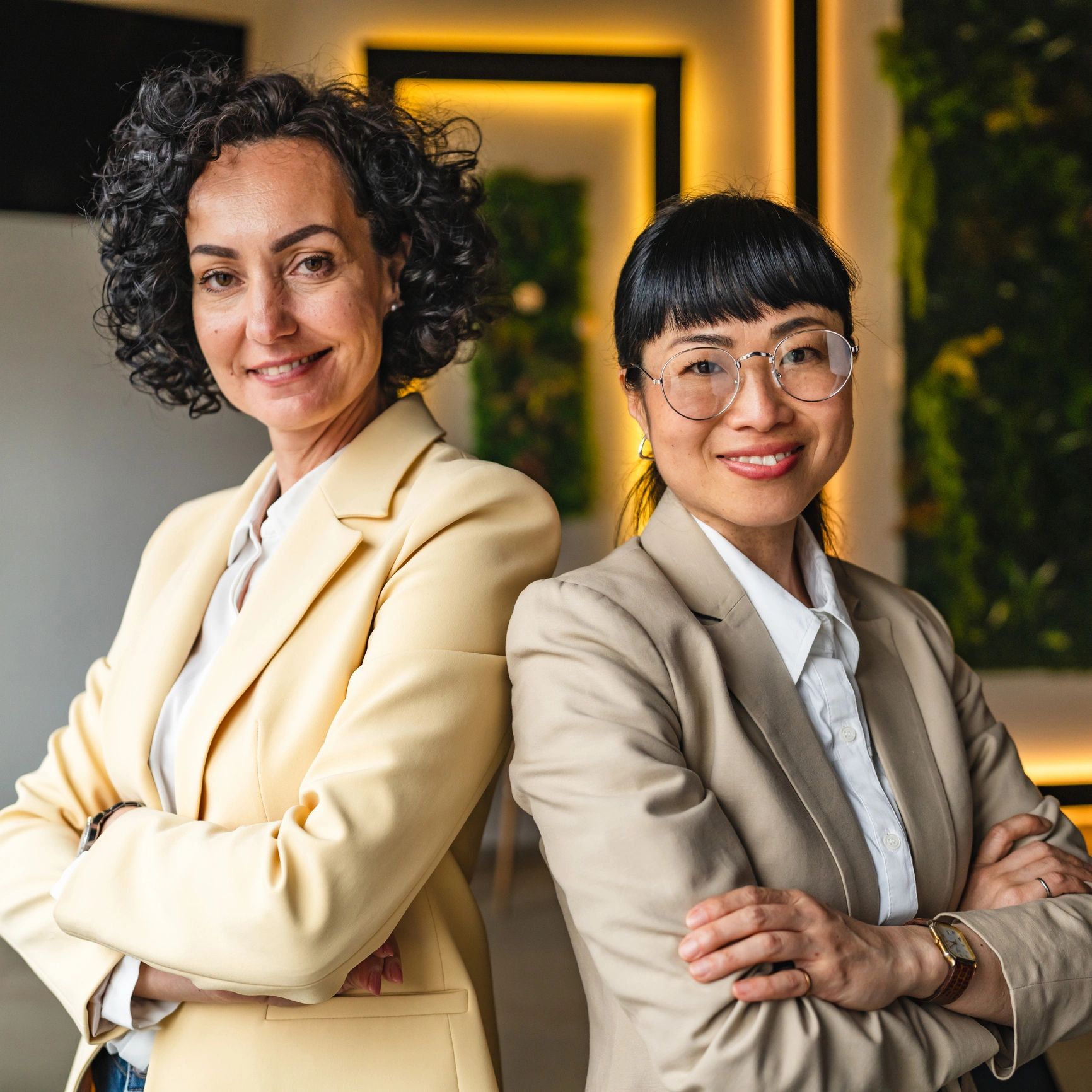 Portrait of two confident women in an office setting