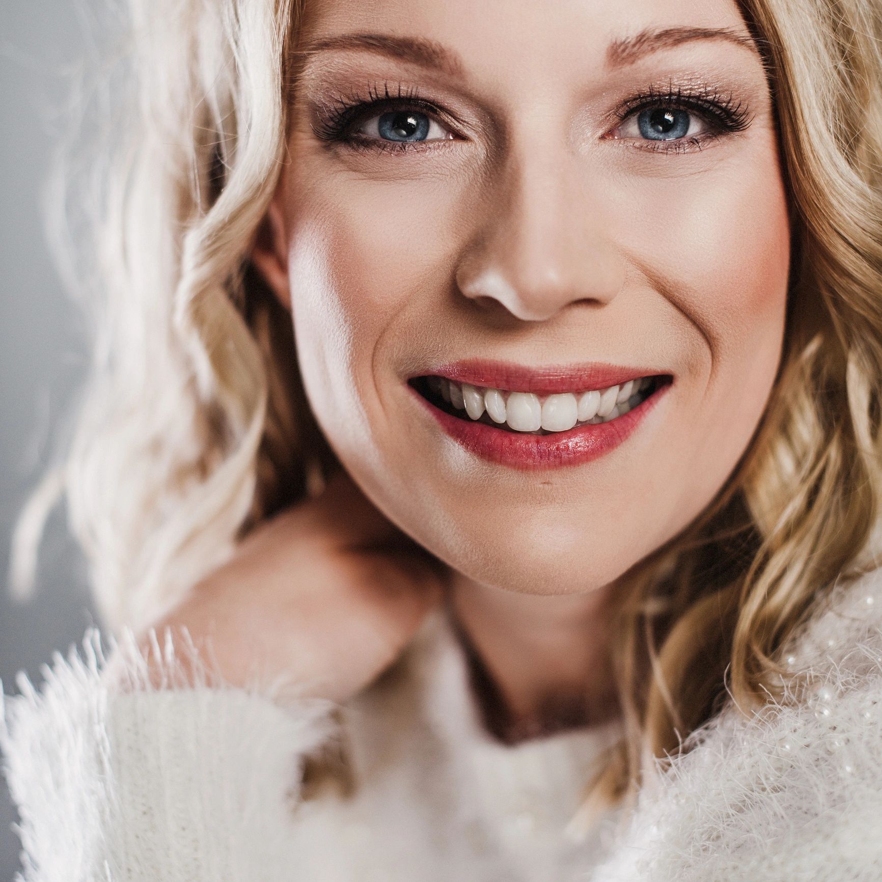 Studio portrait of a happy woman with a warm expression